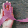 A Purple Ribbon In Hand Diamond Painting